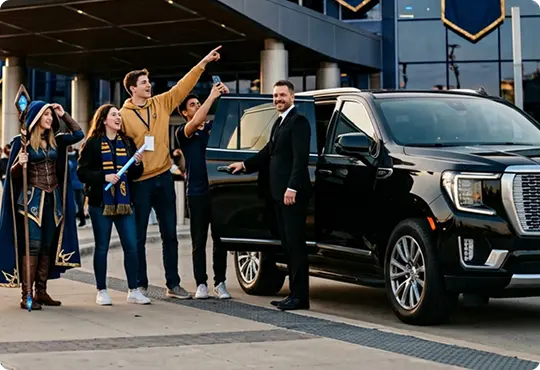 A chauffeur in a black suit opens the door of a black luxury SUV for a group of cheering esports fans, one in cosplay, outside an arena.